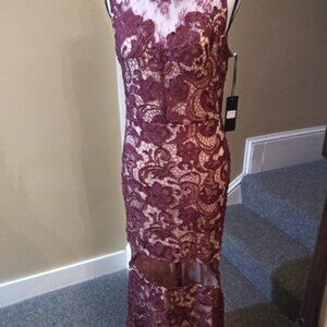 The Clothing Company Gown Color Is Burgandy  that is available NWT!!!!!!
